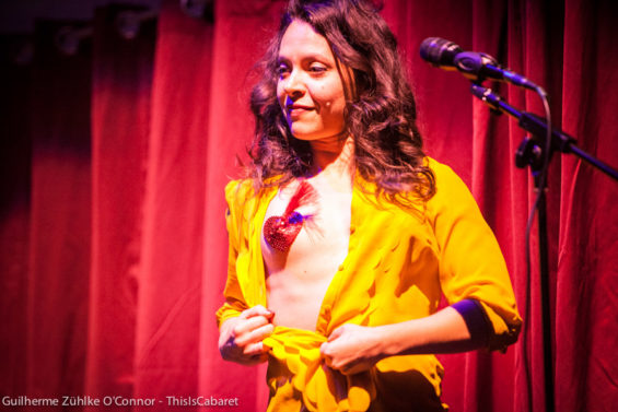 Comedian Elena Procopiu shows a nipple tassel at Cool Britannia