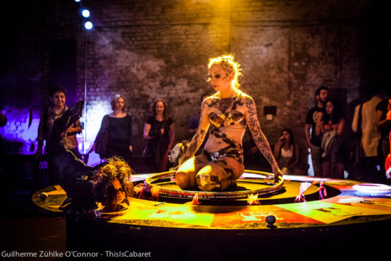 Burlesque dancer Chi Chi Revolver spins the Wheel of Fortune at Carnesky's Tarot Drome