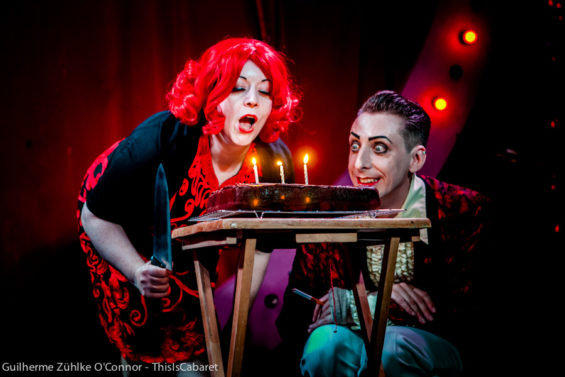 Fire blow with me: Miss Rose Thorne and Benjamin Louche have a little too much fun with cake.