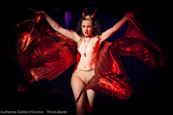 Hell's belle: burlesque dancer Missy Malone spreads her red wings