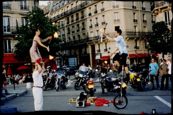 "Pont St Louis, Paris June 1998. Here we are within a year of starting to try our double act, but still a year away from naming ourselves Planet Banana. It is of note that this picture was taken just weeks after losing everything we owned in a truck fire. We had already replaced all our materials for the show except my costume (still the last thing I consider apparently). "